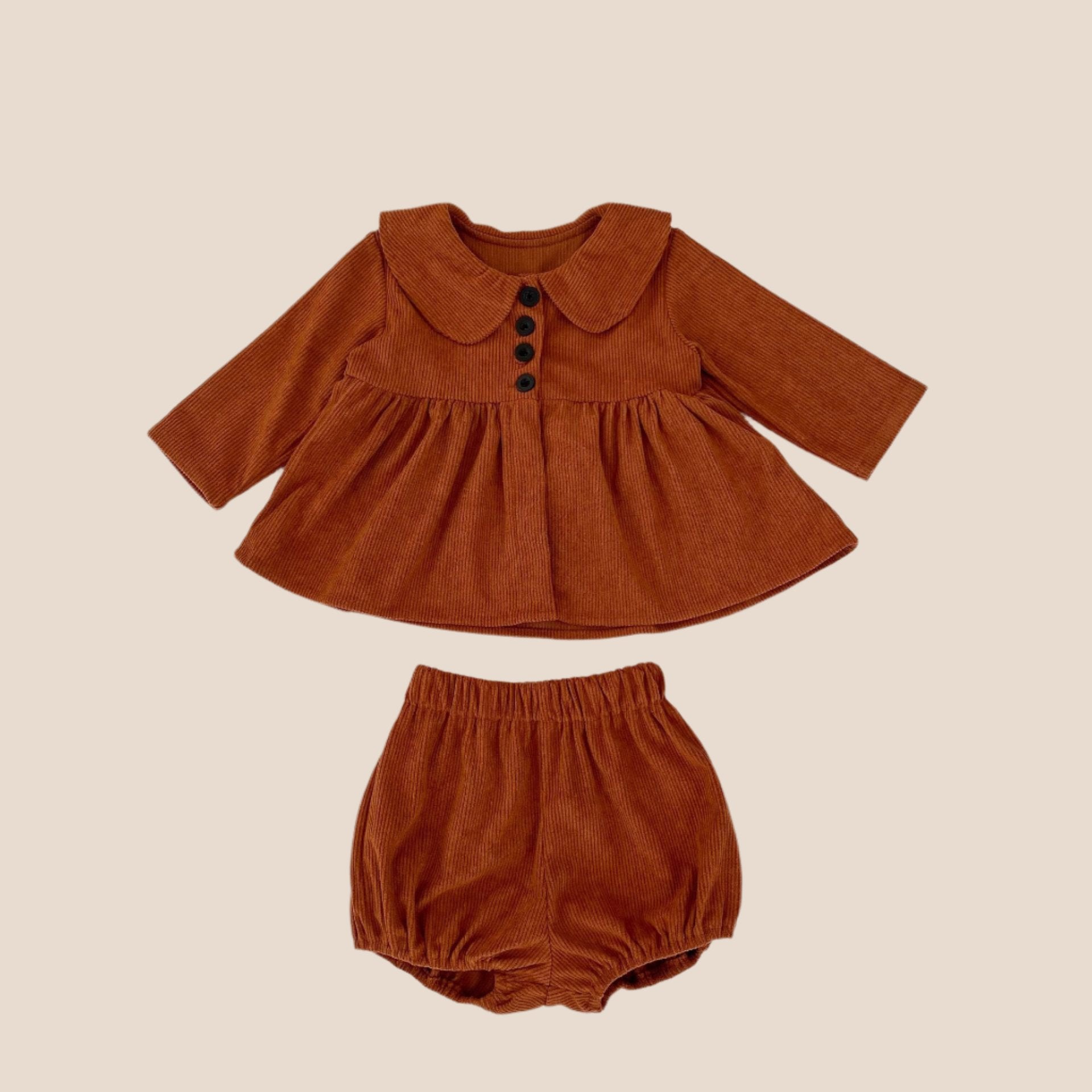Baby girl romper and dress front view close up