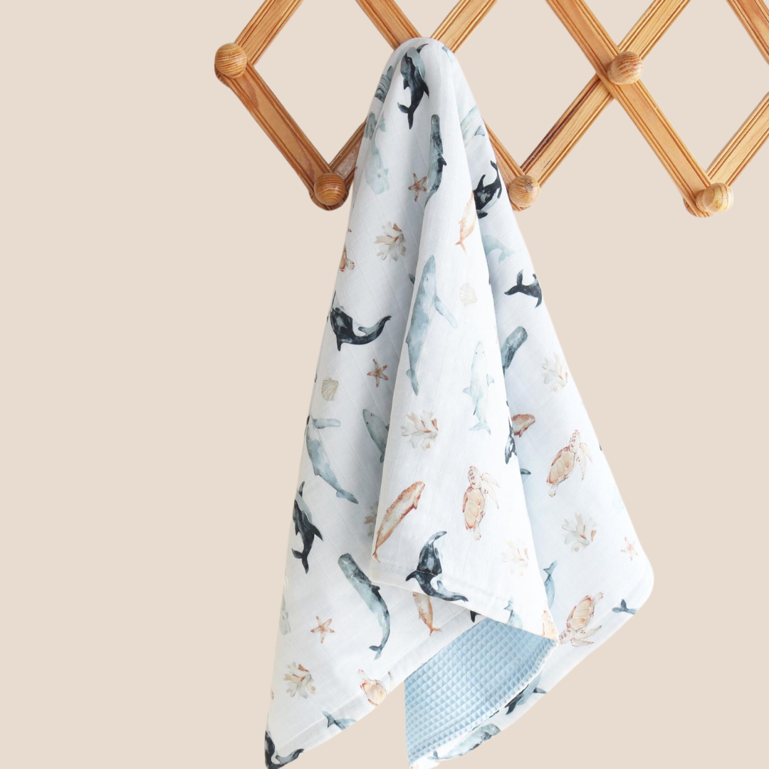 Ocean animal baby blanket hanging on nursery rack – lightweight and breathable design