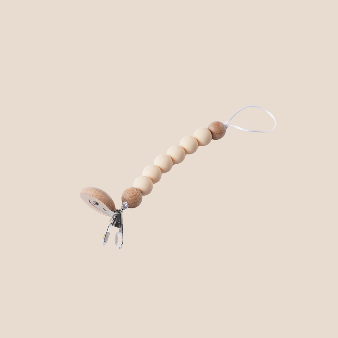 Side view of cream wood clip pacifier holder – eco-friendly baby essentials