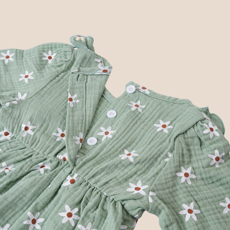 Back button closure of muslin daisy print romper for baby girls