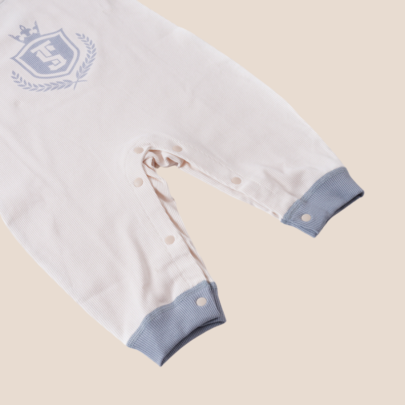 Bottom snap closure and cuffed legs of ribbed cotton baby romper