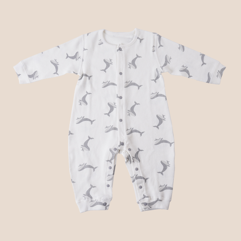 Soft cotton baby romper with whale print and snap front closure