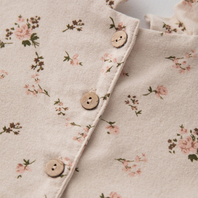 Back button closure on baby girl ruffle collar cotton romper