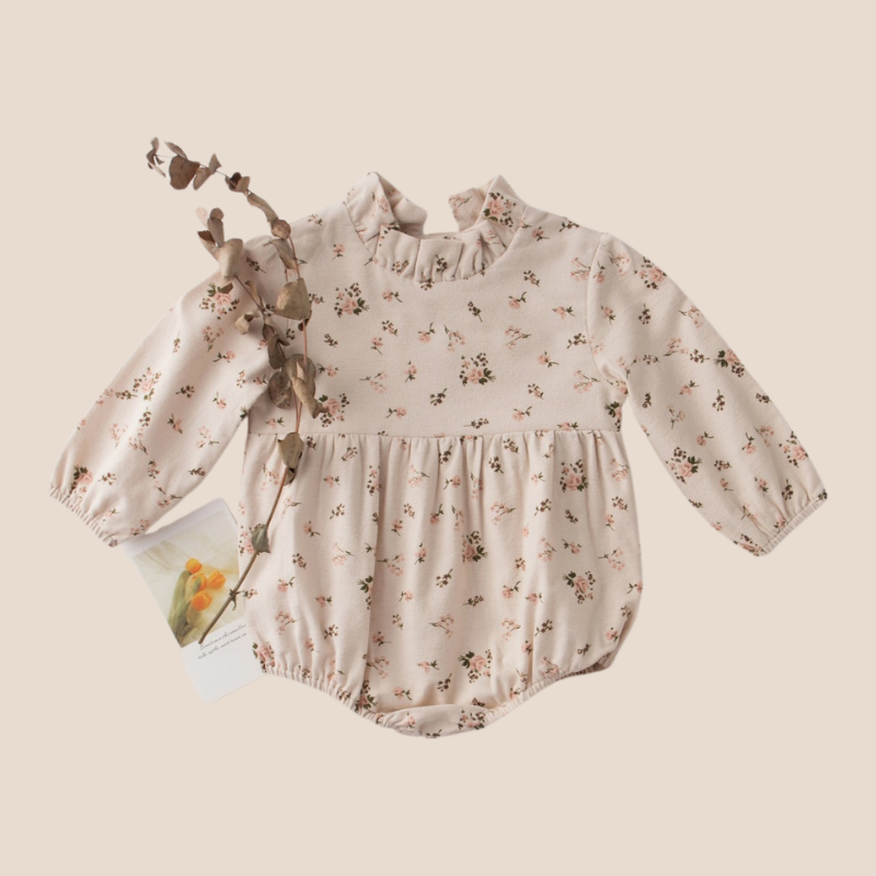 Full view of pink floral baby dress romper – 3 to 6 months