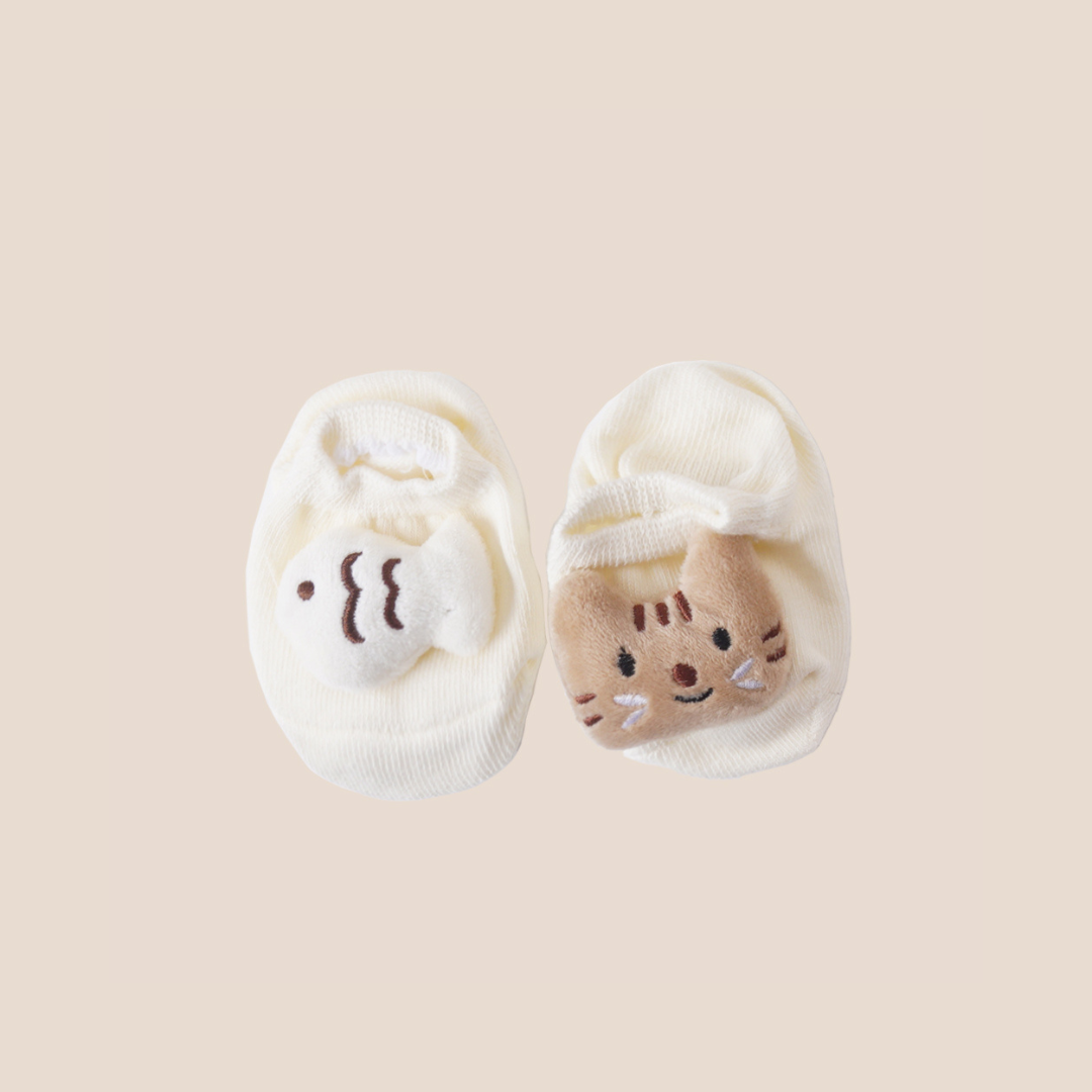 Cream baby socks with soft cat and fish plush detail – unique newborn gift set and baby registry item
