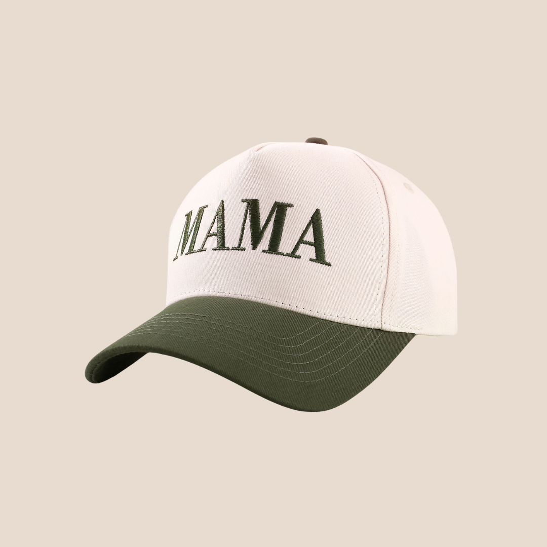 White cap with green brim and 'MAMA' text on a beige background