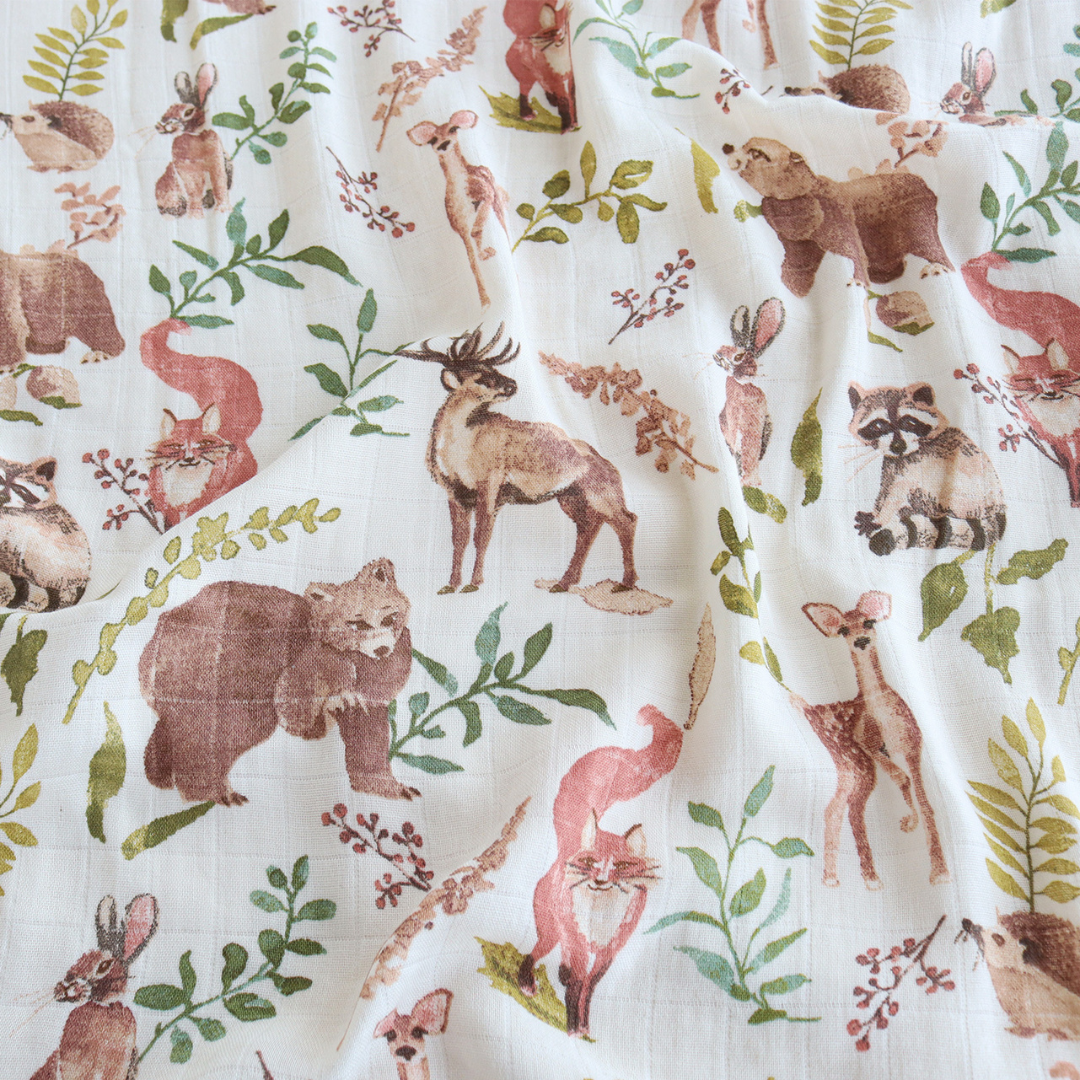 Woodland-themed baby blanket hanging with waffle cotton backing. Perfect baby shower gift idea for making personalized baby shower gift boxes for loved ones and clients.