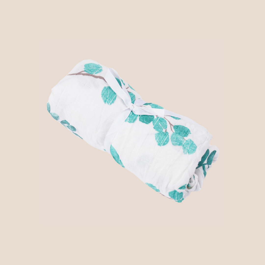 Rolled eucalyptus-themed bamboo cotton swaddle tied with ribbon – premium baby blanket for personalized baby gifts, custom baby shower sets, and sustainable new mom essentials.