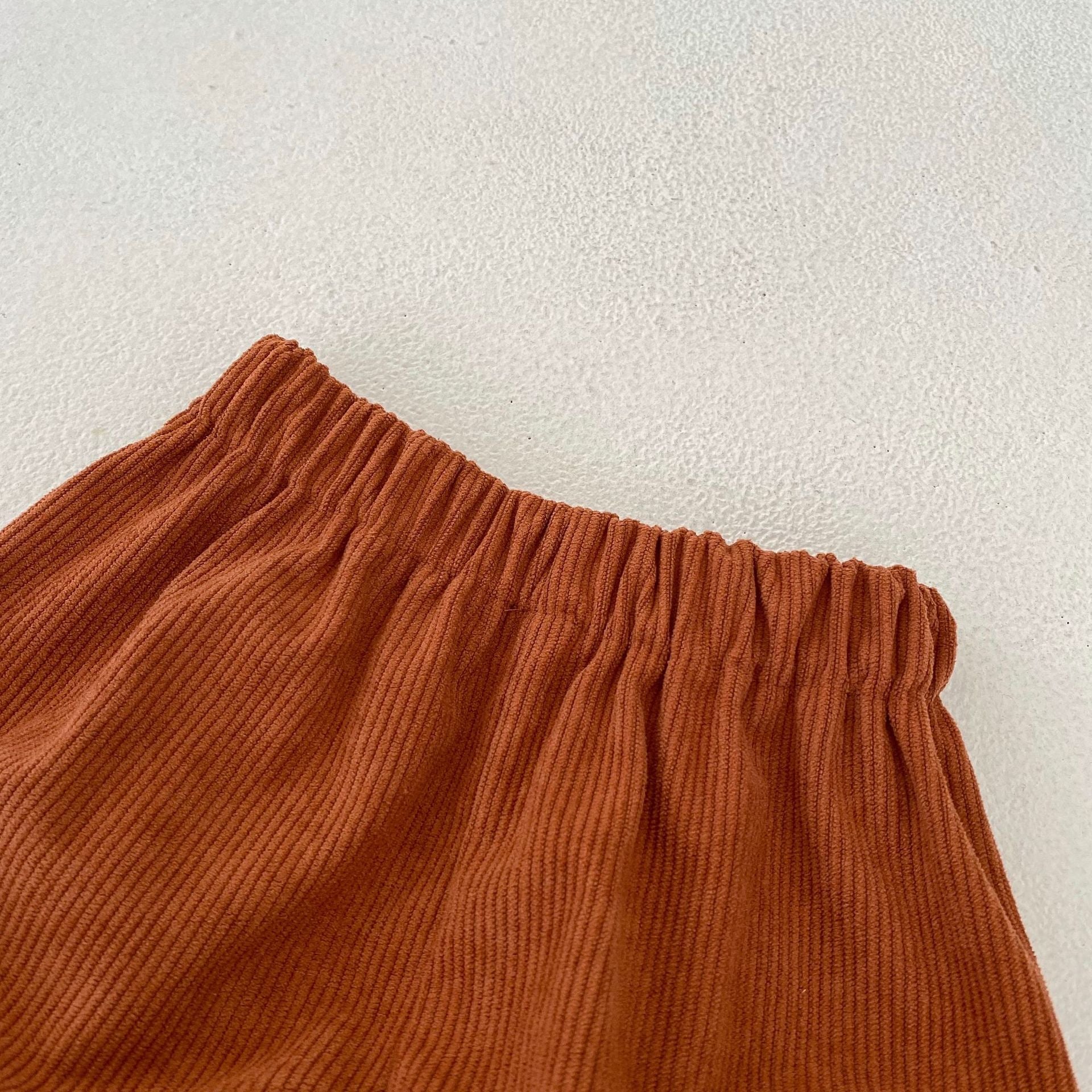 Baby girl corduroy dress bottom close up view