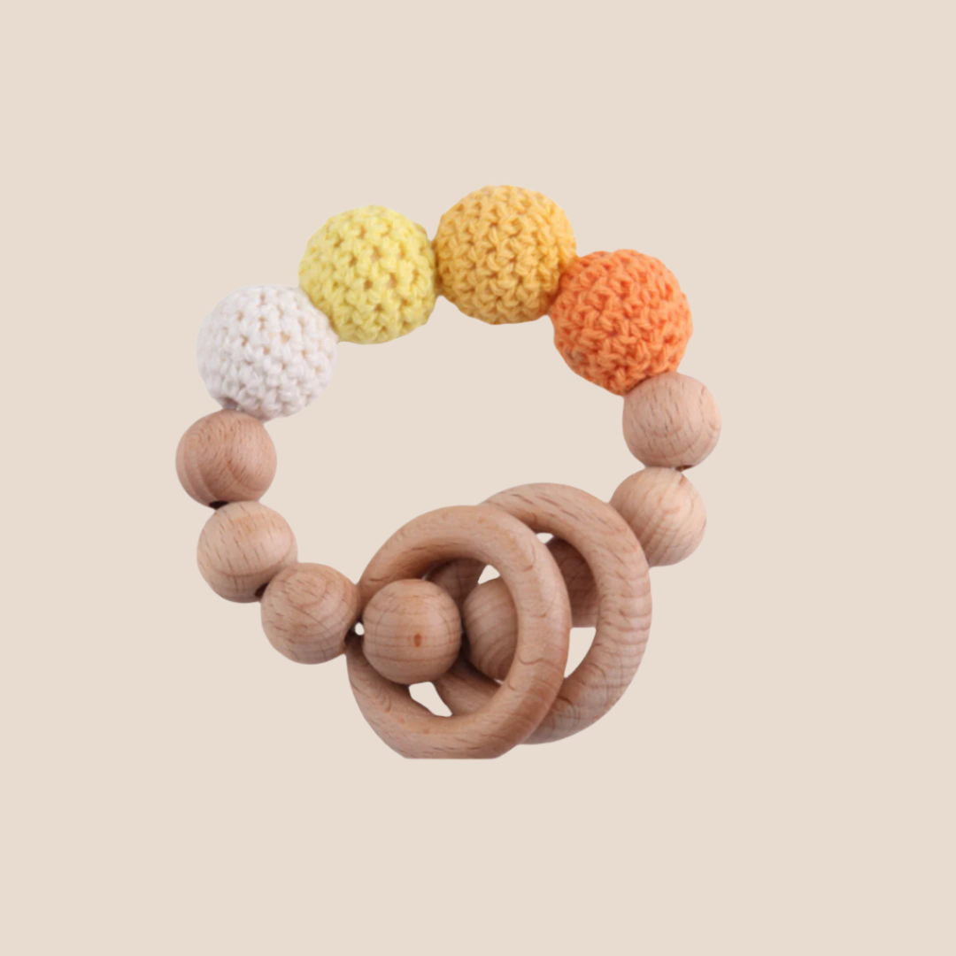 hand knitted and wooden natural and ecofriendly baby teether toy yellow