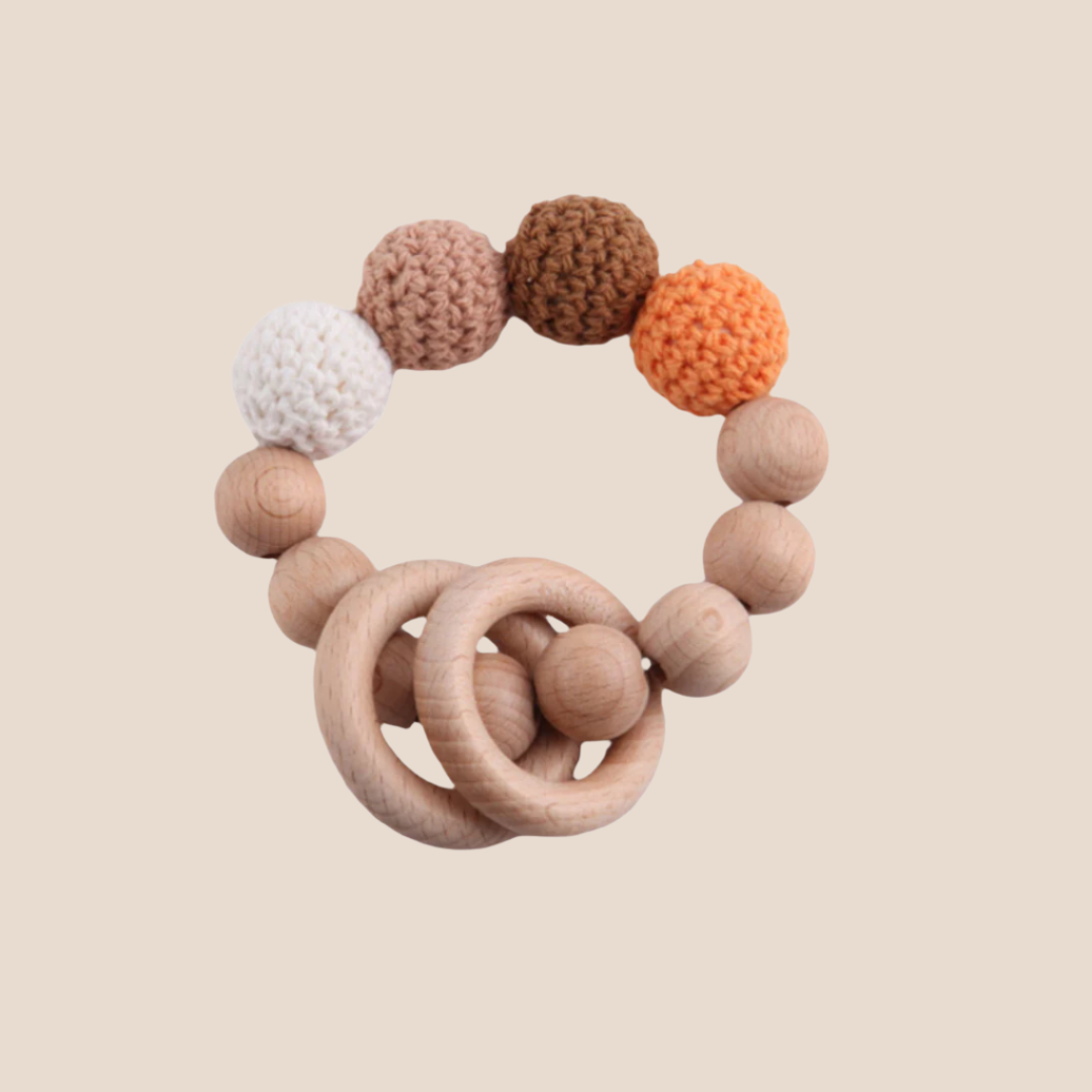 hand knitted and wooden natural and ecofriendly baby teether toy brown