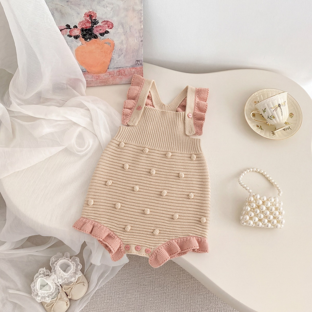 Cotton Craft blush ruffle knit baby romper in cream with pink trim and textured bobble details