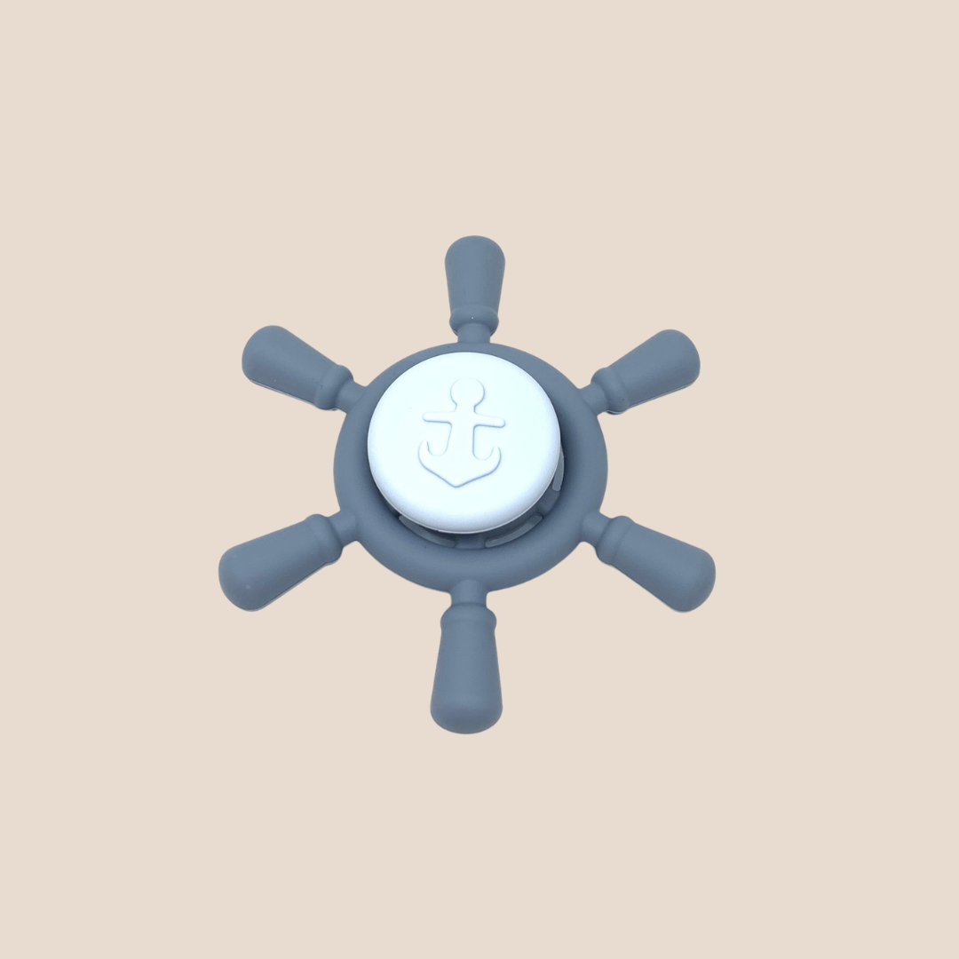 Cotton Craft dusty blue silicone ship wheel sensory spinner baby toy with anchor design