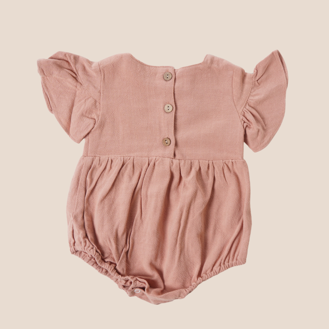 Back view of romper with wood buttons – elegant choice for baby shower gifting or premium baby gift boxes