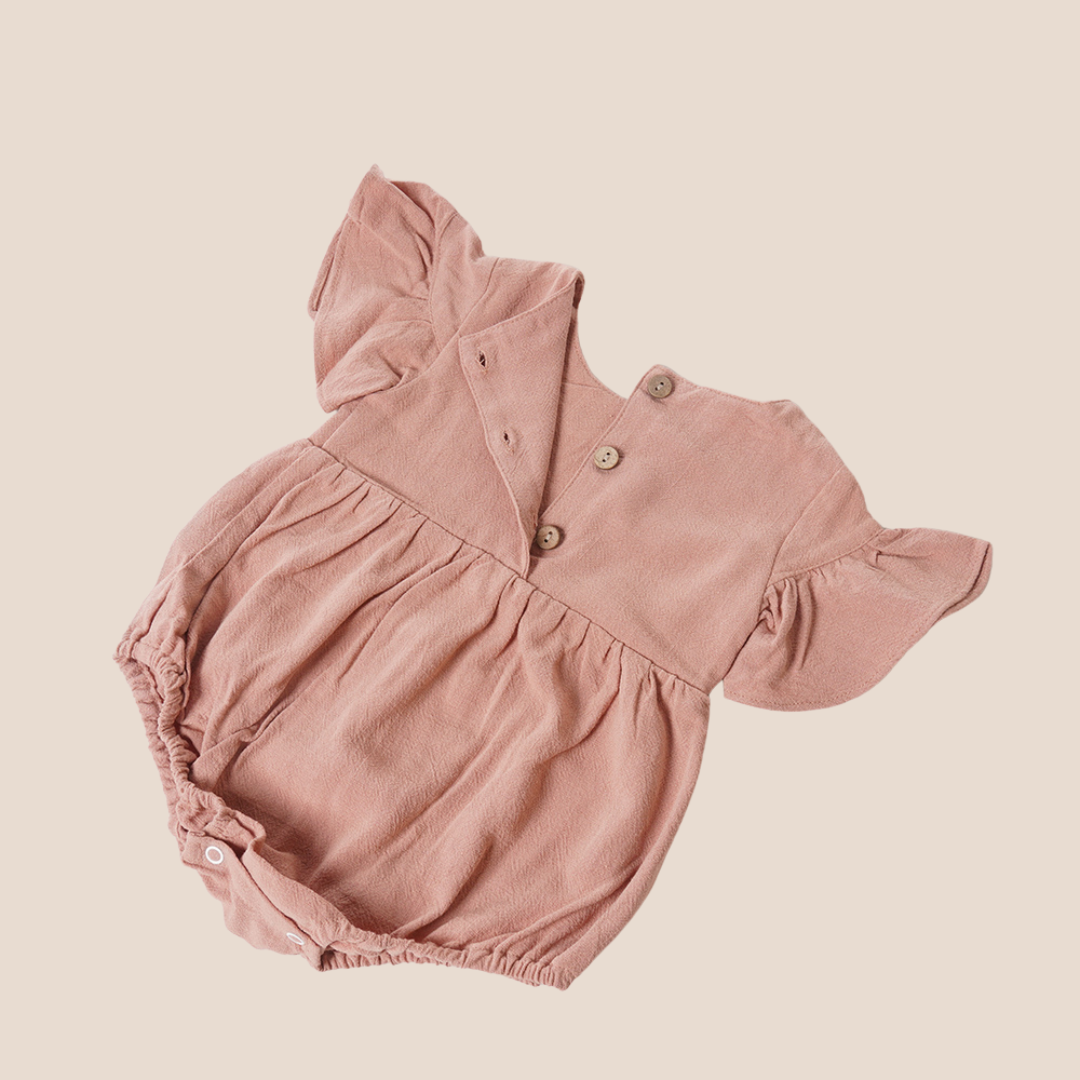 Back button opening of clay rose romper – part of our custom baby gifting collection for clients and loved ones