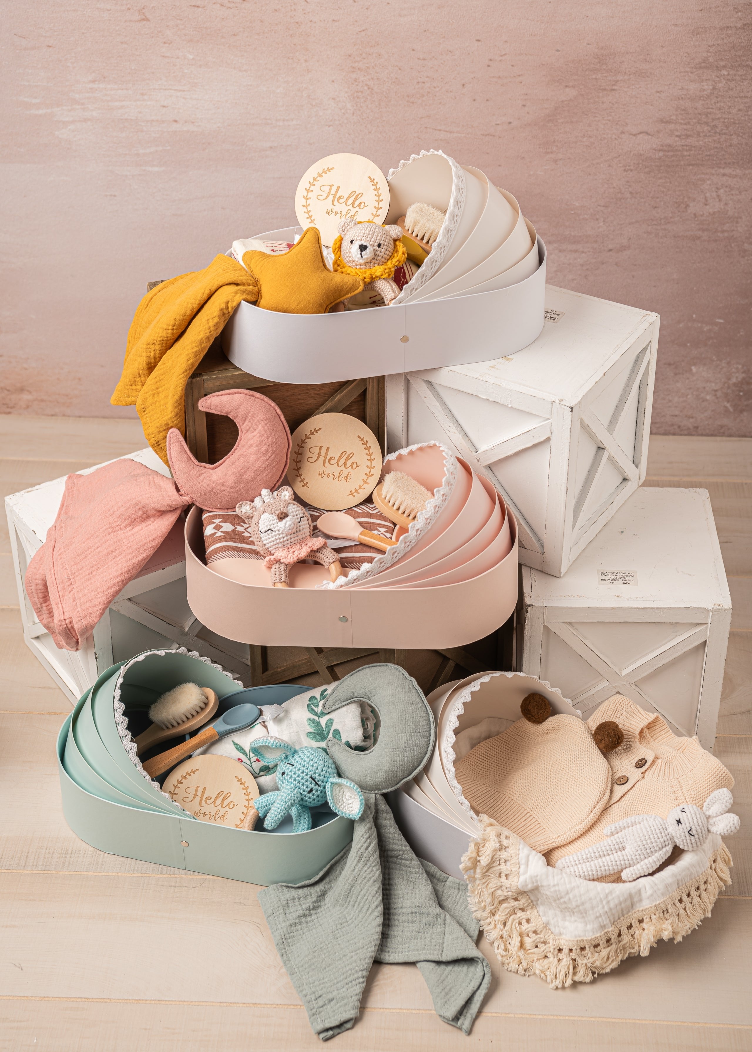 newborn baby gift basket for baby showers with swaddle blanket, baby knitted teether toy, baby brush and welcome card in 4 colors.