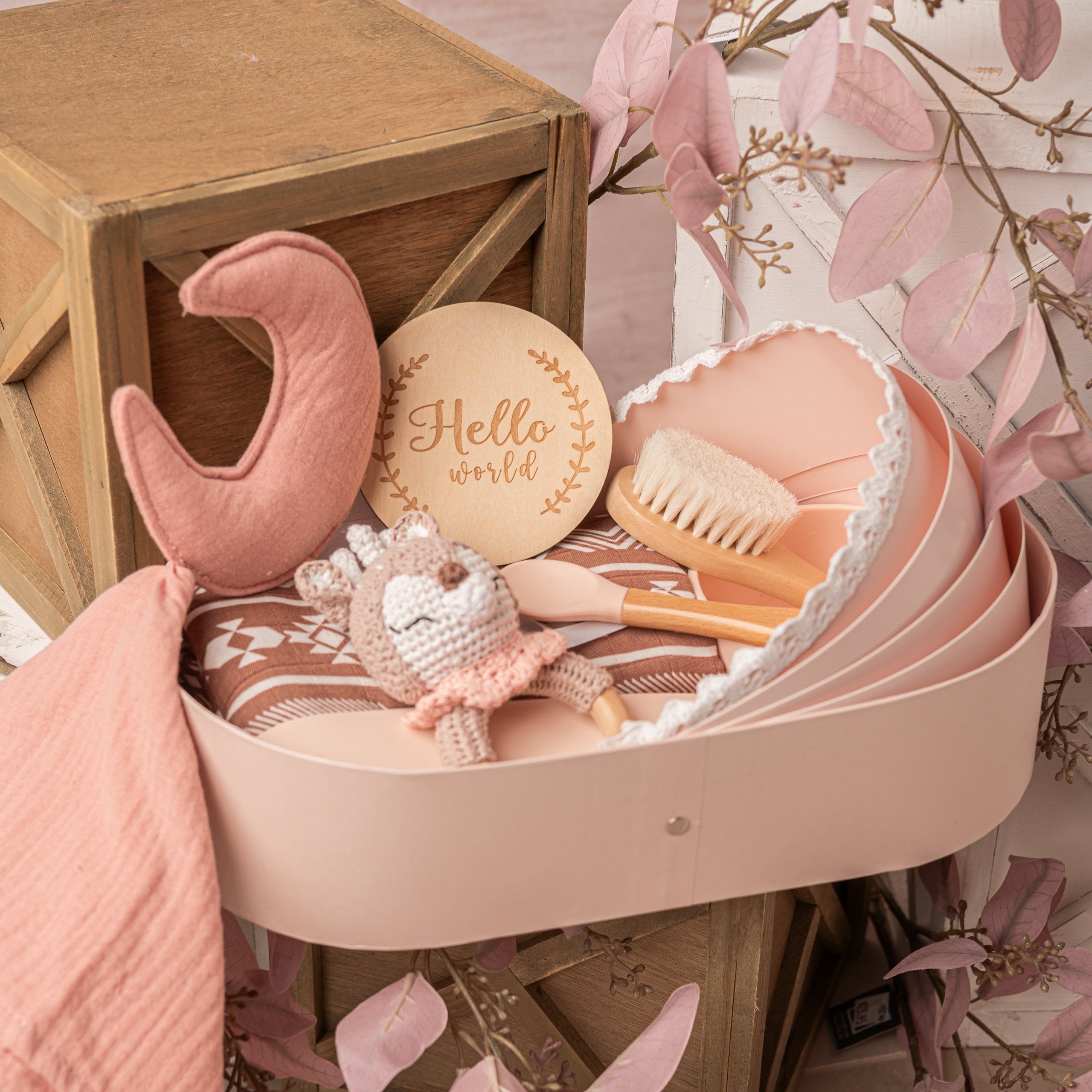 newborn baby gift basket for baby showers with swaddle blanket, baby knitted teether toy, baby brush and welcome card in pink color