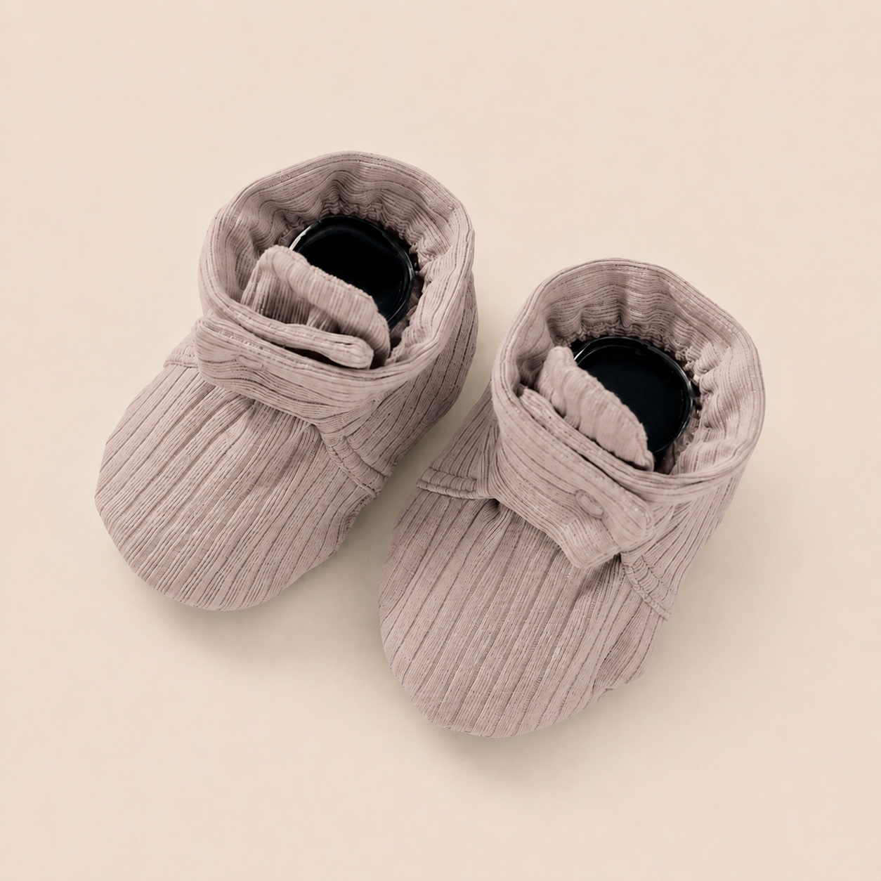 Premium baby booties made from breathable organic cotton muslin for everyday comfort.