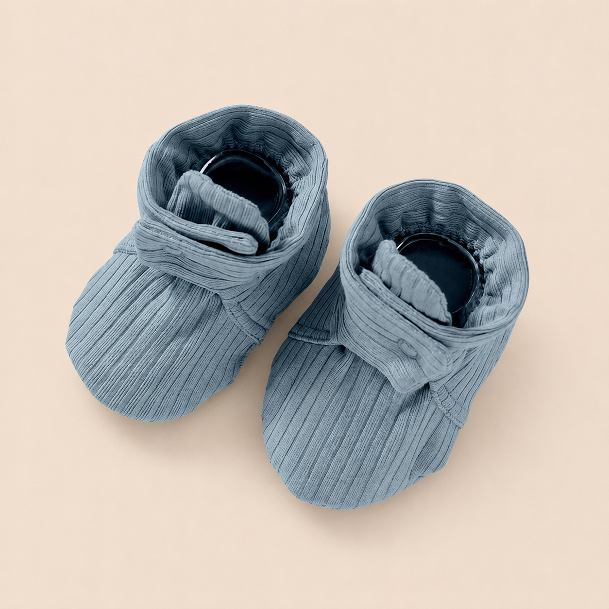 Sage blue organic cotton muslin booties for newborns and infants.