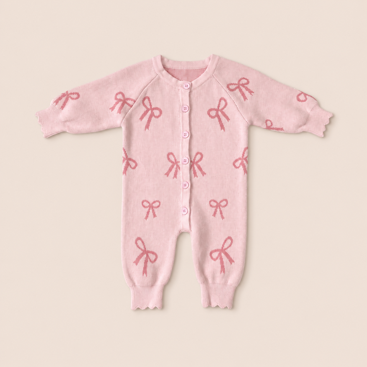 Pink Bow Knit Baby Romper & Headband Set made from 100% worsted cotton for babies 3–6 months.