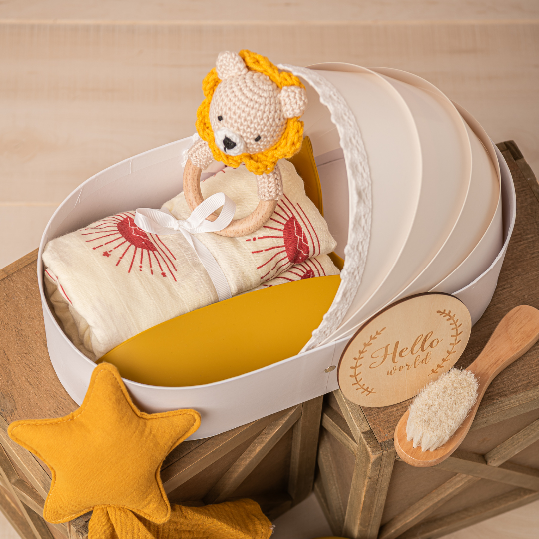 newborn baby gift basket for baby showers with swaddle blanket, baby knitted teether toy, baby brush and welcome card in yellow color with lion toy