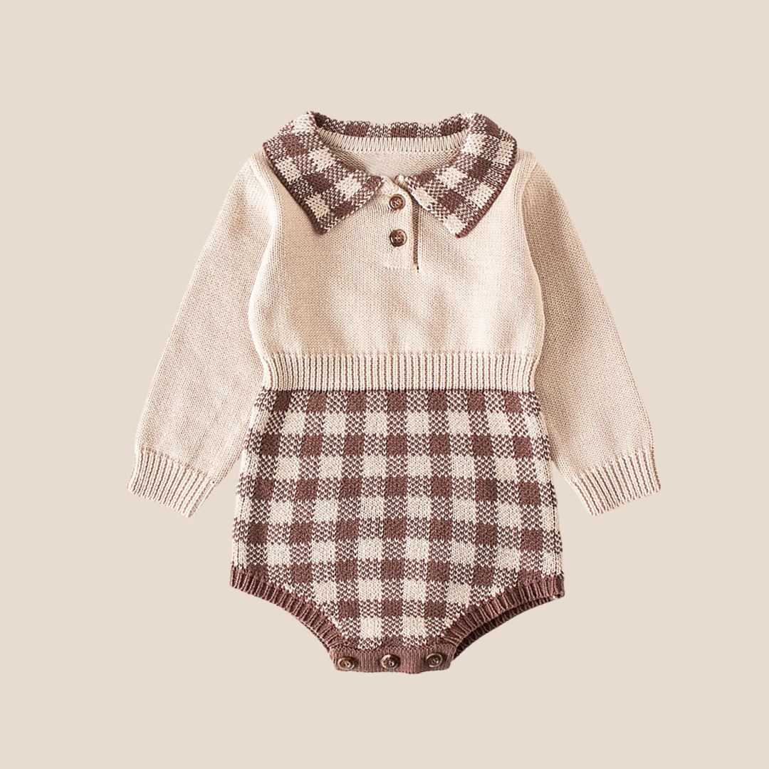 Knitted baby romper with plaid pattern on a beige background.Neutral knit gingham baby romper in beige and cocoa – perfect 0–6M baby shower gift, heirloom-style baby outfit for fall or new baby gifting