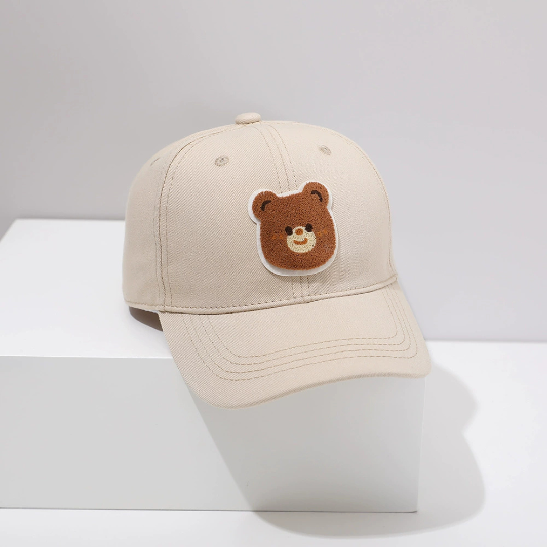 Neutral baby hat with teddy bear patch