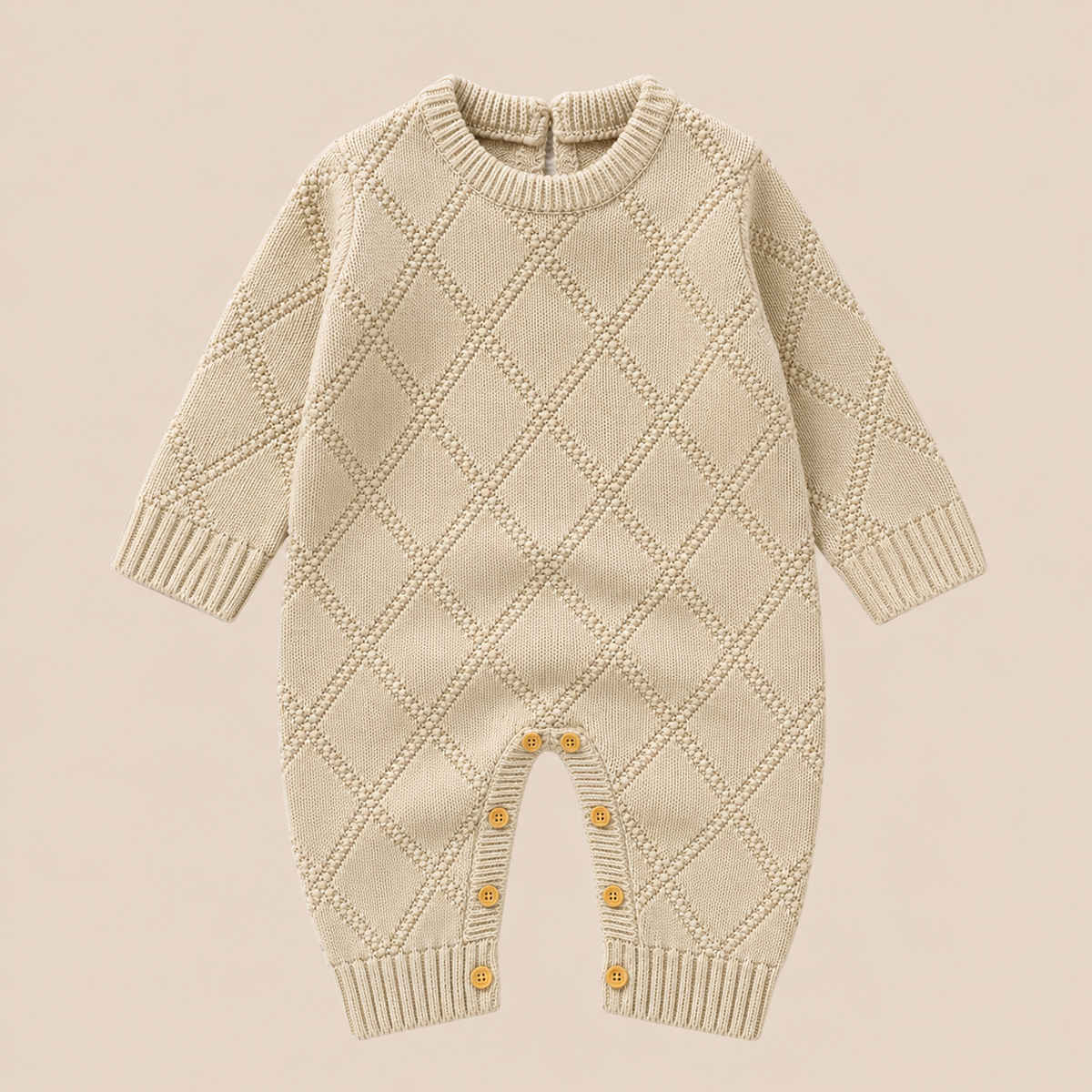 Cotton Craft Little Heirloom Diamond Knit Baby Romper in oatmeal beige with textured diamond pattern and leg buttons.