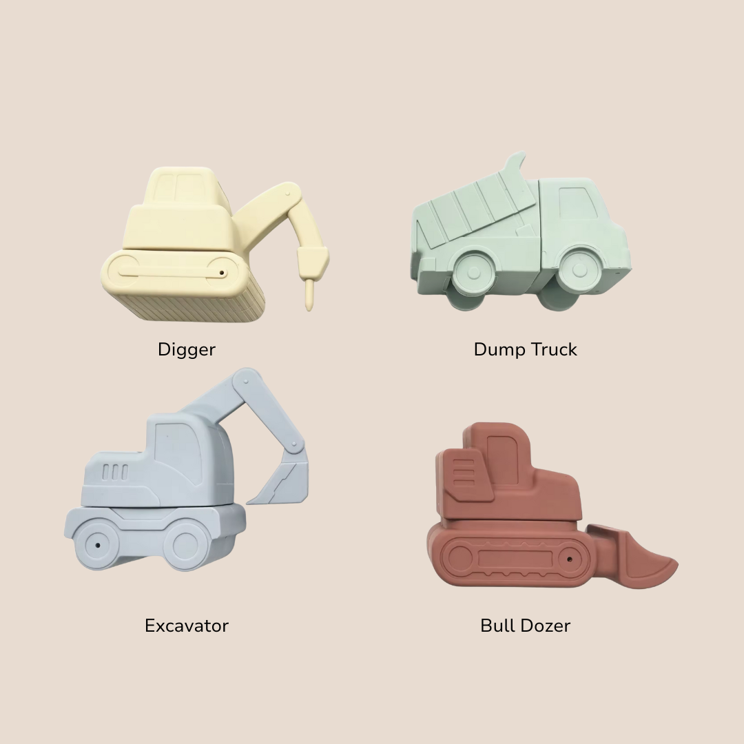 Four toy construction vehicle shapes in different colors on a beige background