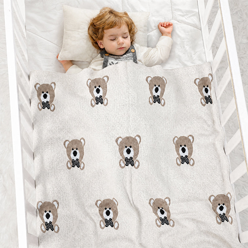Soft gender neutral baby blanket with teddy bear pattern